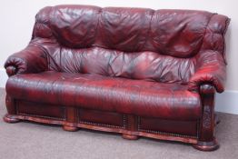 Pair oak framed three seat sofas upholstered in ox blood red leather (W200cm),