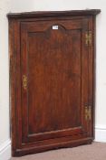 18th century oak corner cabinet, enclosed by single panelled door, with two shaped shelves, W71cm,