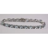 Oval aquamarine and diamond bracelet stamped 750 (aquamarine approx 14 carat) Condition