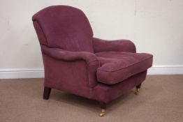 Howard style armchair upholstered in purple fabric,