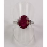Oval ruby and diamond ring hallmarked 18ct (ruby approx 3.