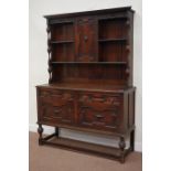 Early 20th century oak dresser fitted with two cupboards and two drawers with raised cupboard and