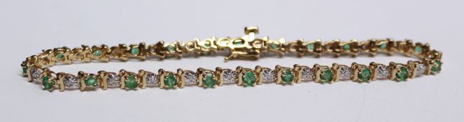 Emerald and diamond tennis bracelet hallmarked 9ct Condition Report <a