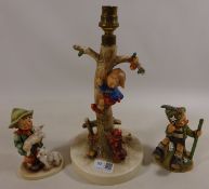 Hummel table lamp and two medium Hummel figures (3) Condition Report <a