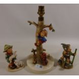 Hummel table lamp and two medium Hummel figures (3) Condition Report <a