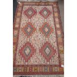 Turkish Soumak rug, embellished with stylised animal motifs on beige field,