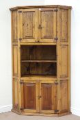 Large pine panelled corner cabinet, double cupboard above and below, with shelving space, W120cm,