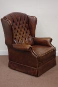Georgian style wing back armchair upholstered in antique brown leather Condition Report