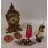 Gilded metal striking mantle clock, white metal Eastern condiment set,