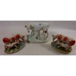 Staffordshire model of a milk maid with cow and a pair of Staffordshire type cow groups (3)