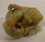 Pale green Jade caved model of a Dog and Pup,