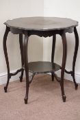 Early 20th century walnut shaped top centre table, with undertier, D75cm,