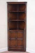 Ercol oak corner display shelves fitted with single cupboard below, W77cm,