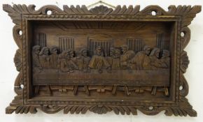 A carved panel depicting the Last Supper,