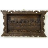 A carved panel depicting the Last Supper,