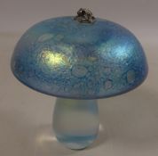 Glasform iridescent toadstool paperweight with a silver hallmarked frog,