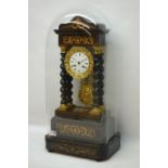 19th century French Empire period ebonised Portico clock with inlaid plinth and pedestal,