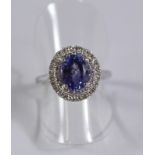 Tanzanite and two row diamond cluster ring hallmarked 18ct Condition Report <a