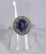 Tanzanite and two row diamond cluster ring hallmarked 18ct Condition Report <a