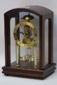 Walnut cased German torsion clock, striking on bell CLOCKS & BAROMETERS - as we are not a retailer,