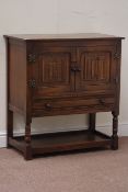 Oak side cabinet enclosed by carved linenfold doors, fitted with single drawer and under tier,