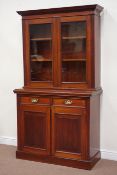 Edwardian mahogany bookcase on cupboard, with two drawers, W110cm, H195cm,