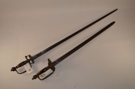 Two similar Georgian swords, 81cm and 61cm blades, brass hilts with double shell guards,