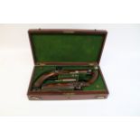 Fine cased pair of Officer's mid 19th century 14 bore percussion pistols by T K Baker London,