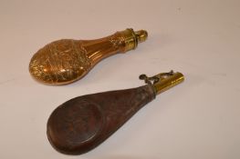 19th century embossed brass powder flask by G & J W Hawksley Sheffield 21cm and a leather shot