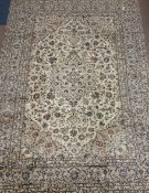 Persian Kashan rug, cream ground, overall floral design, large central medallion,