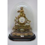 Late 19th century gilt metal mantle clock, white enamel dial surmounted by figure of a lady,