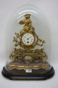 Late 19th century gilt metal mantle clock, white enamel dial surmounted by figure of a lady,