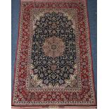 Persian Isfahan rug, central floral medallion on blue field of interlaced floral motifs,
