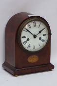 Edwardian mahogany mantle clock, white enamelled dial with Roman numerals on brass bun feet,