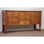 'King Fisher' oak sideboard fitted with five drawers and two panelled cupboards, W168cm, H91cm,