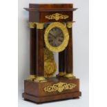 Victorian gilt metal mounted mahogany portico clock, the stepped top on Doric columns,