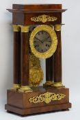 Victorian gilt metal mounted mahogany portico clock, the stepped top on Doric columns,