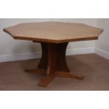 'Mouseman' oak adzed octagonal concave dining table, raised on cruciform base, D149cm,