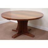 'Mouseman' oak circular adzed top dining table raised on cruciform base,