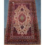 Persian rug, floral central pole medallion on beige field, interlacing floral design,