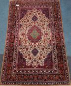 Persian rug, floral central pole medallion on beige field, interlacing floral design,