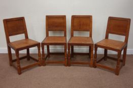 Set four 'Mouseman' oak dining chairs, figured adzed panel backs,
