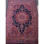 Persian Meshed rug, large rosette medallion on blue field, decorated with all over floral design,