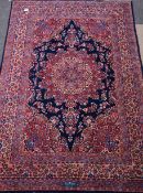 Persian Meshed rug, large rosette medallion on blue field, decorated with all over floral design,