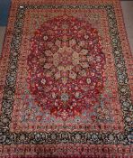 Persian Meshed rug, plum red ground, all over floral design, boteh motif to guards,