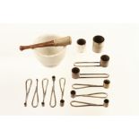 Twelve numbered chemists brass powder measures (No 2 missing) and a small pestle & mortar by