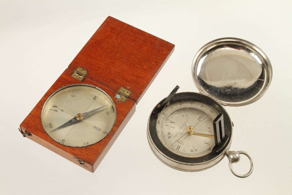 A steel cased prismatic compass with folding sights and a wood cased compass (Jay Gaynor