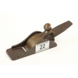 An iron thumb plane with brass lever,