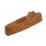 An 18c miniature fruitwood smoothing plane 5 1/2" x 1" with thin brass strips let into the sole