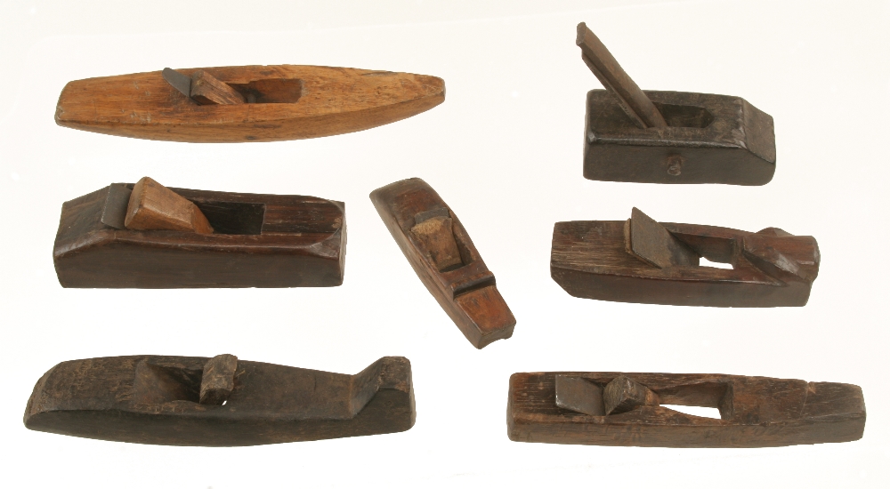 A collection of 7 small primitive hardwood planes 4 1/2" to 7" long G